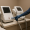 medical professional with gloves operating a cosmetic laser device in a treatment room.