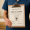medical professional holding a clipboard with a medical license certification.