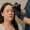 a clinician administers a forehead injection to a relaxed patient receiving a neuromodulator treatment.