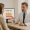 a provider explains the laser lipo renuvion process to a patient using a visual cross-section of fat layers on a screen.