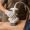 a gloved practitioner applies a t-shape 2 device to a patient’s thigh during a cellulite reduction session.